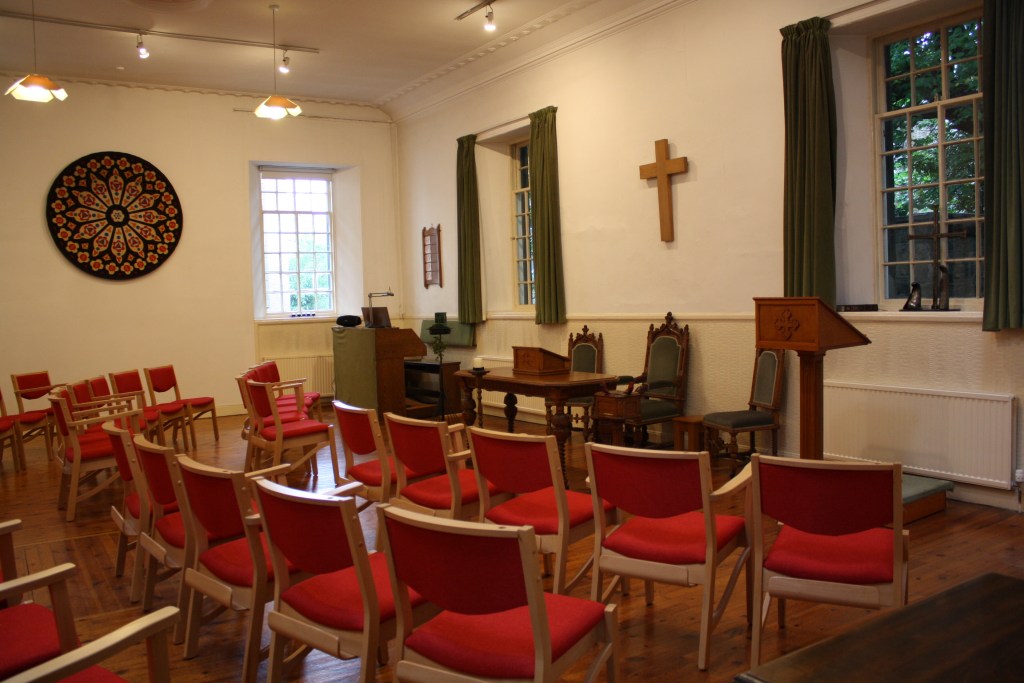 A church hall with chairs set lecture-style