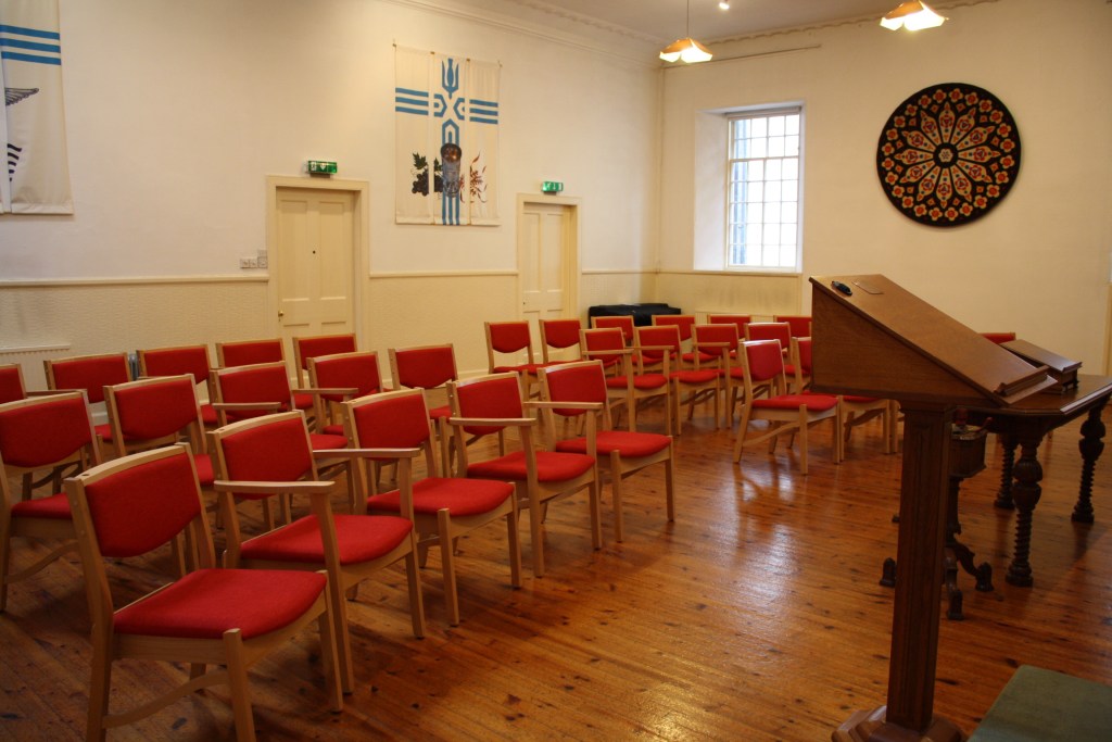 A church hall with chairs set lecture-style
